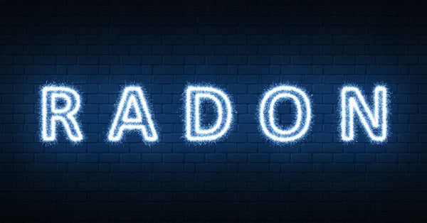 The word "Radon" is written in all capital letters in white glowing text on a blue faux brick background.