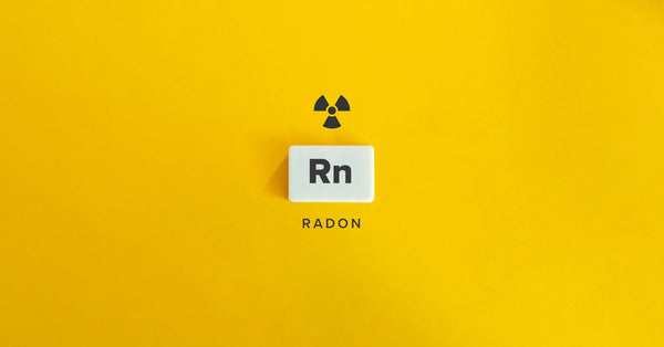 The word "Radon" sits below the radioactive symbol and a tile that reads "Rn" against a bright yellow background.